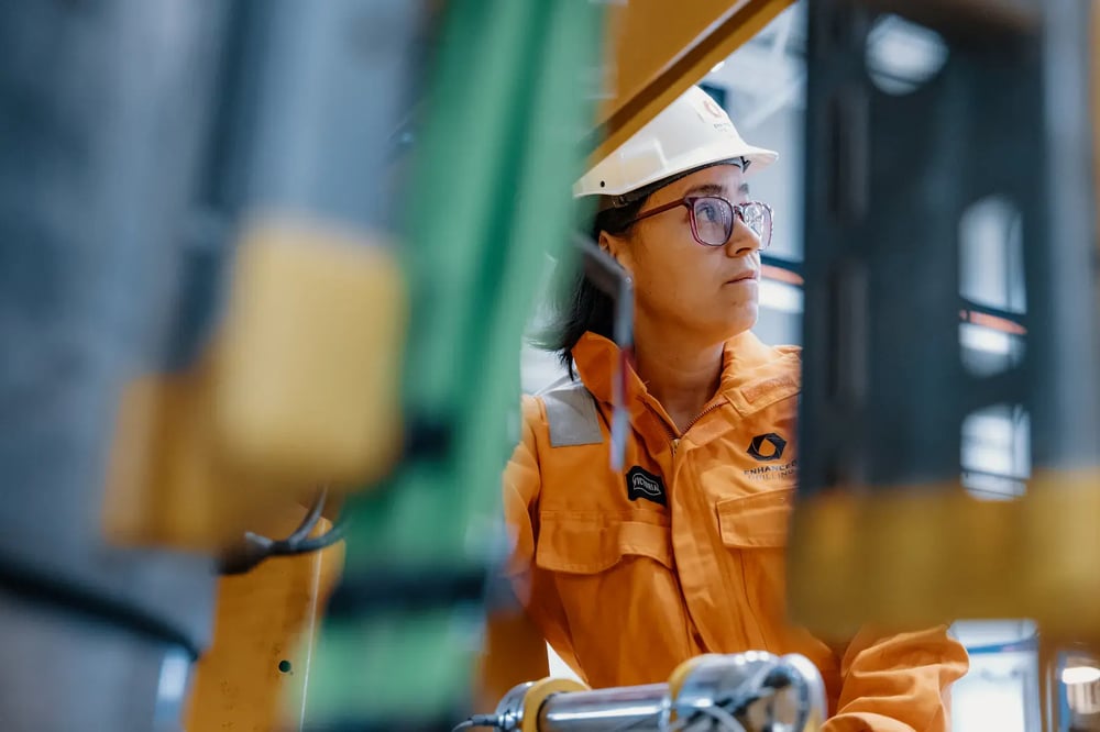 Enhanced Drilling engineer in safety gear inspecting equipment inside the workshop. Enhanced Drilling engineer in safety gear inspecting equipment inside the workshop.